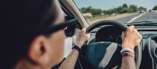 istock Woman driving car 868989448