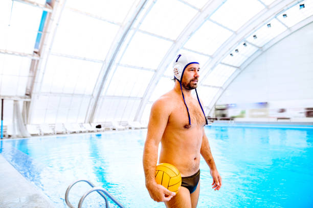 istock Water polo player in a swimming pool. 868992192