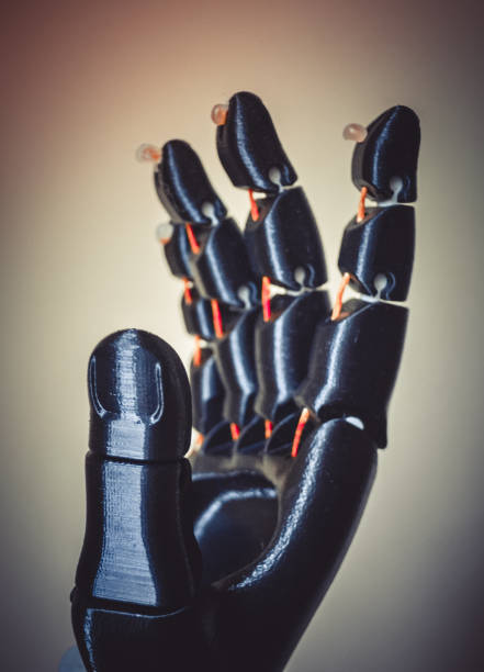 Robot hand fingers from plastic Robot hand fingers from plastic close-up. Automatic three dimensional performs plastic modeling. Modern 3D printing technology. 3d printing hand stock pictures, royalty-free photos & images