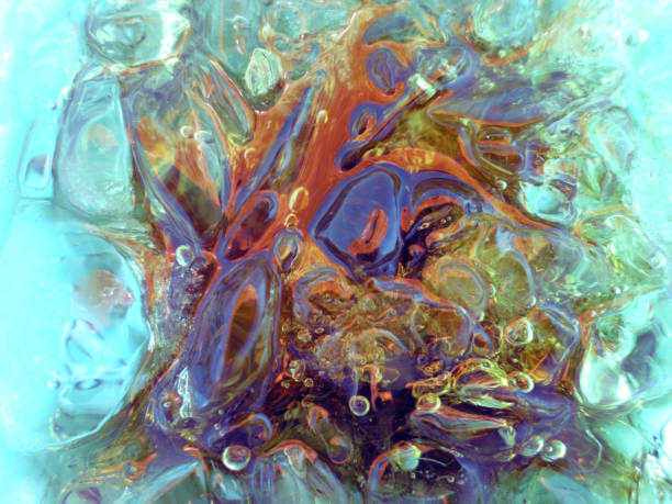 istock abstract backgrounds with ice cubes over wet glass 868997142