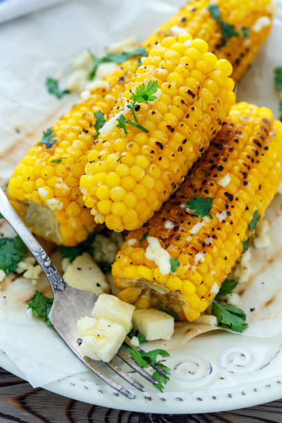 istock Grilled corn with butter, homemade cheese and cilantro. 869015866