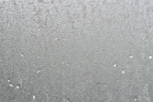 istock Frosty patterns on the glass winter background 869023348