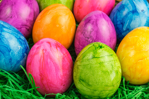 colorful painted easter eggs in a nest