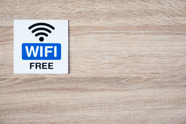 istock free WiFi sign on the wooden wall with space for adding text on the right side and under 869026034