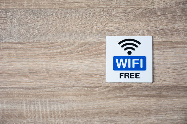 istock free WiFi sign on the wooden wall with space for adding text on the left side 869026042