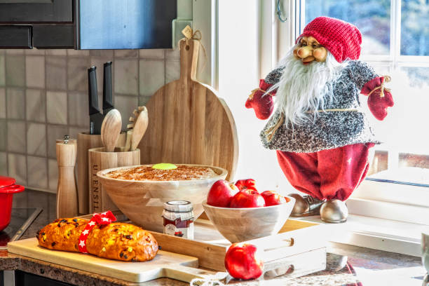 Santa doll with porridge with butter and cinnamon at the kitchen bench