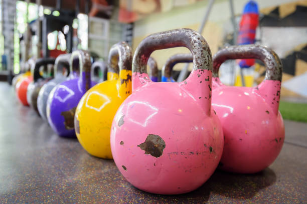 istock colorful kettlebells in a row in a gym 869034386
