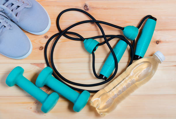 istock Rubber expander, sneakers, dumbbells and bottle of water 869036680