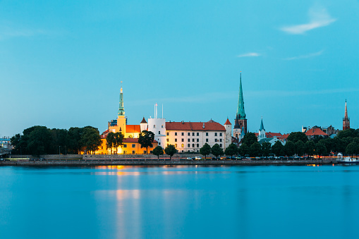 Latvia. Riga Castle. Landmark, President Residence On Embankment Of Daugava In Evening Illumination