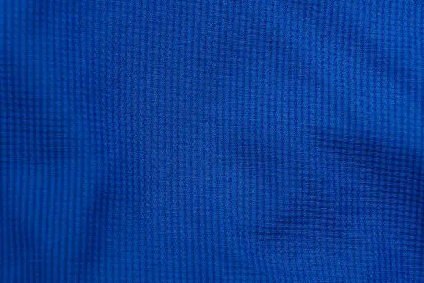 Photo of blue background of cloth from a piece of clothing