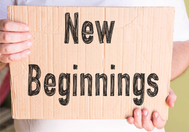 istock new beginnings on cardboard holding by man 869054426