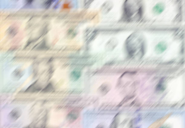 istock American dollar of different denominations blured background. 869056976