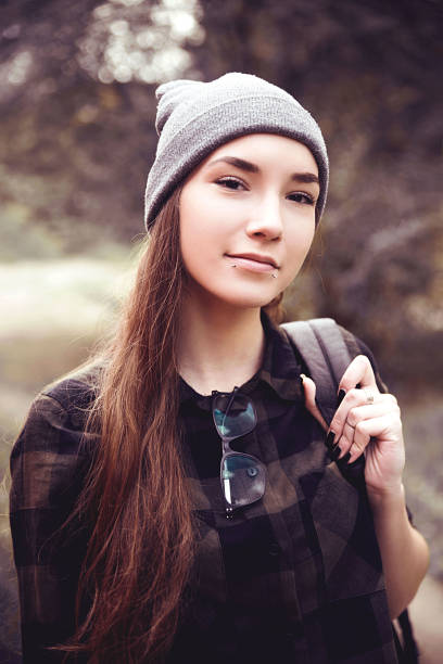 istock Young pierced woman in nature 869061274