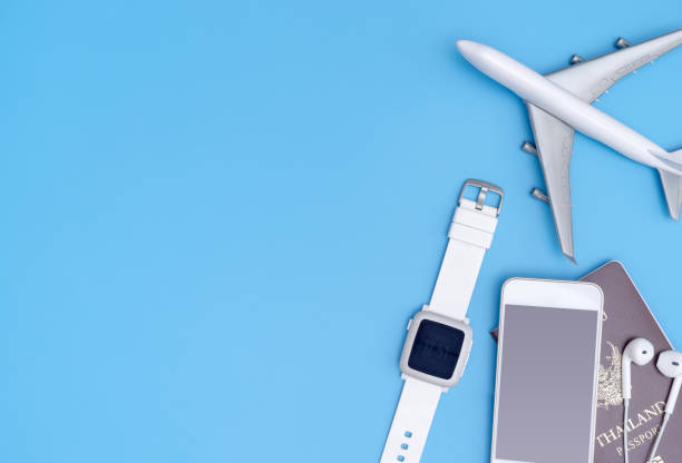 istock White travel gadget and object on blue copy space for travel concept 869065304