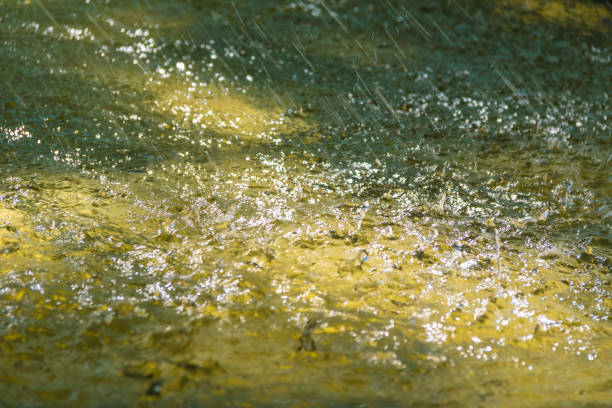 istock Abstract photo of many falling drops 869069770