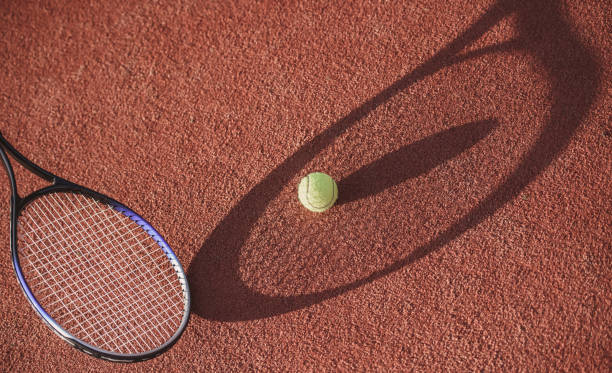 istock Tennis ball on court 869070838
