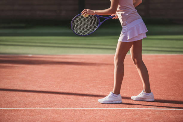 istock Girl playing tennis 869073644