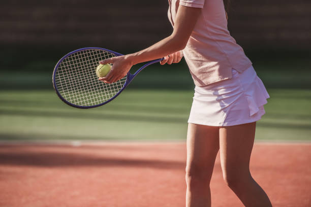 istock Girl playing tennis 869073714