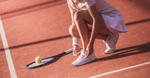 istock Girl playing tennis 869073908