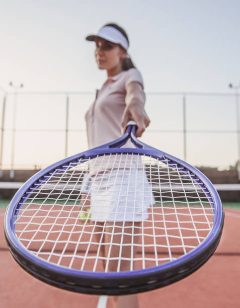 istock Girl playing tennis 869074856