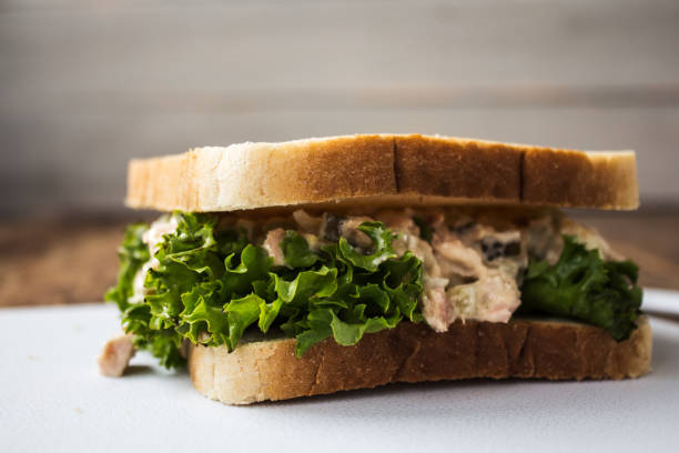 istock tuna pickles sandwich with salad on white plate 869077080