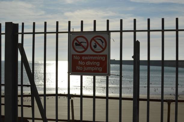 istock Warning safety signs at Newhaven harbour. 869077170
