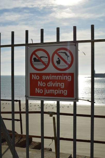 istock Warning safety signs at Newhaven harbour. 869077184