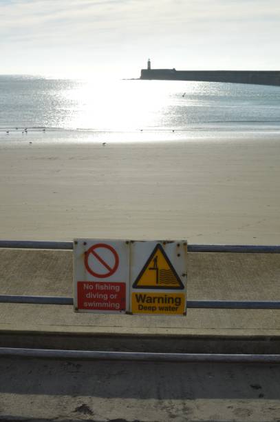 istock Warning safety signs at Newhaven harbour. 869077238