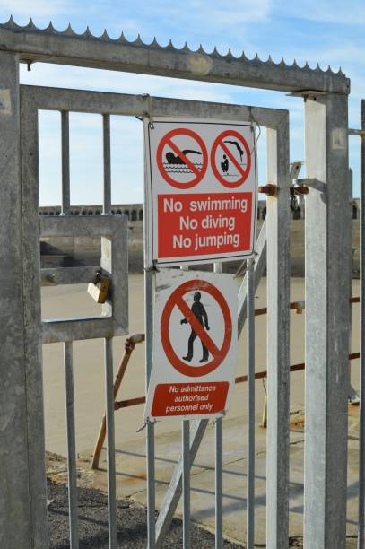 istock Warning safety signs at Newhaven harbour. 869077256