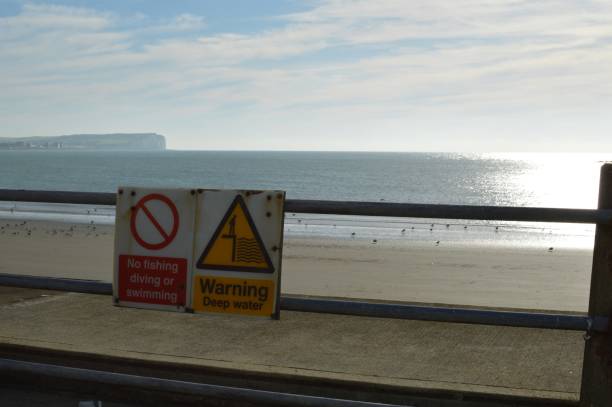 istock Warning safety signs at Newhaven harbour. 869077290