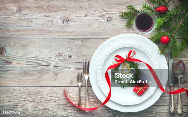 Served Dinner Table Elegant Arranged With Christmas Decorations Stock Photo - Download Image Now