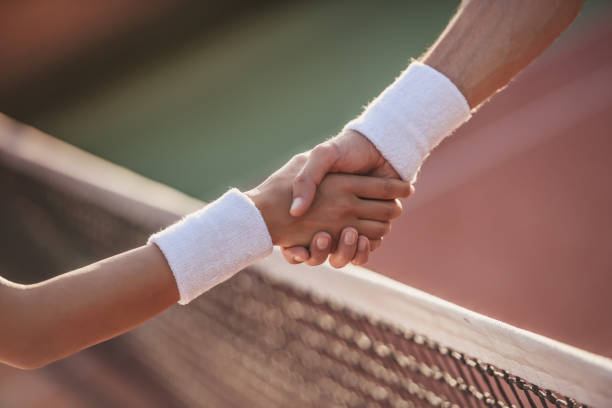 istock Couple playing tennis 869077598