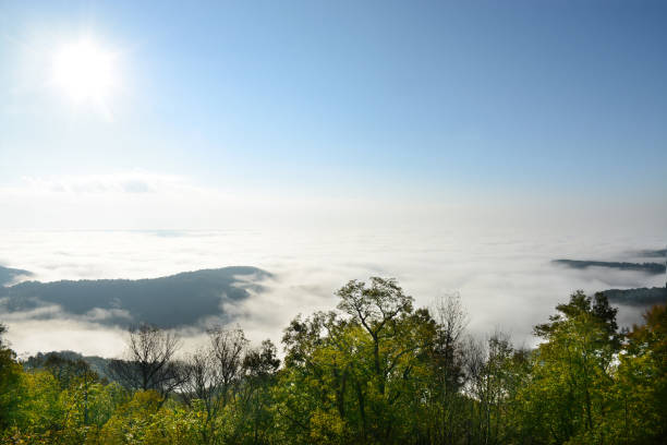 istock Mountain range landscape with clouds over the mountains. 869077810