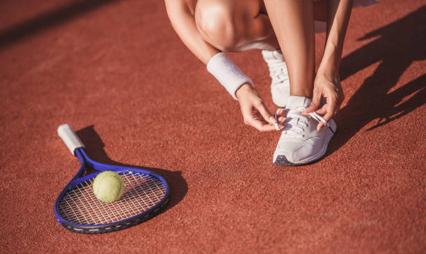 istock Girl playing tennis 869077916