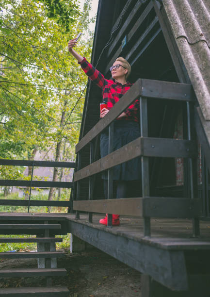 istock woman sitting on an old porch 869080486