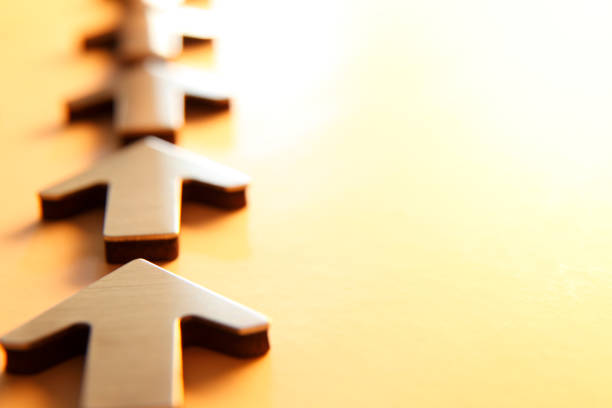 istock Row Of Arrow Pointing In The Same Direction Away From Camera 869081306
