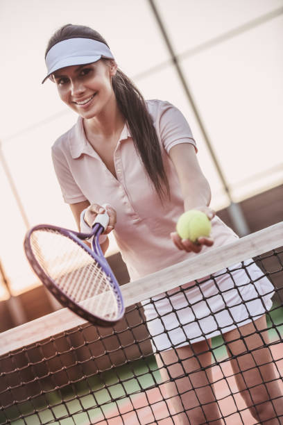 istock Girl playing tennis 869084170