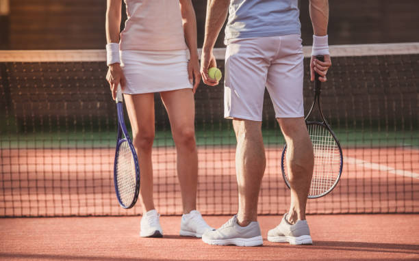 istock Couple playing tennis 869084260