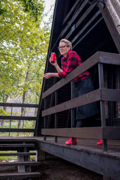 istock woman sitting on an old porch 869084412