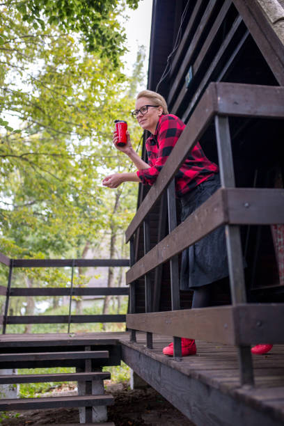 istock woman sitting on an old porch 869084822