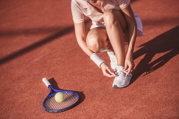 istock Girl playing tennis 869085020