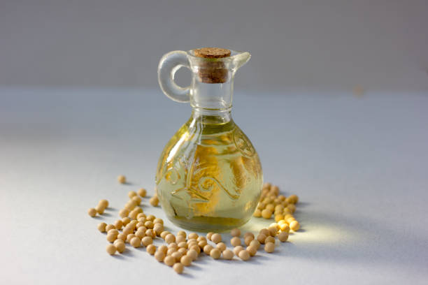 istock Natural soy bean oil with soybeans near it. 869086004