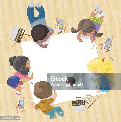 istock children draw together on a large sheet of paper 869096266
