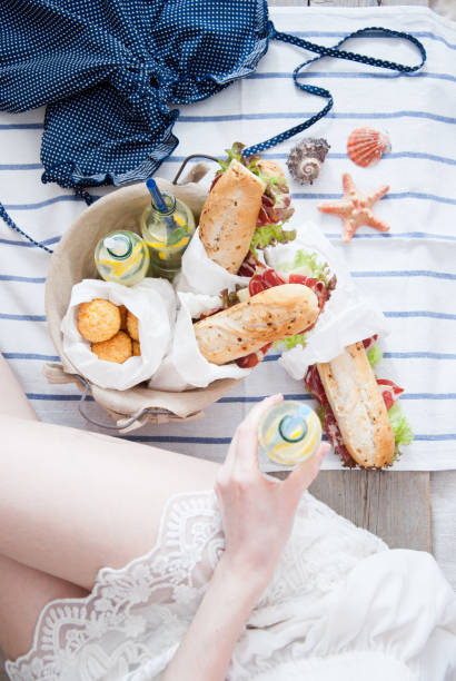 istock Picnic ham sandwiches and lemonade in a basket 869099486