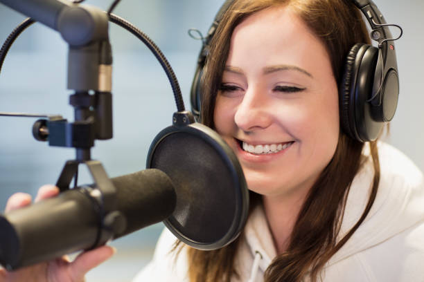 istock Jockey Smiling While Using Headphones And Microphone In Radio St 869099670