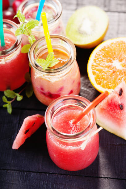 istock Jars with smoothies and fruits 869102592