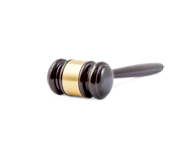 istock Wooden judge's hammer isolated on white. 869105730