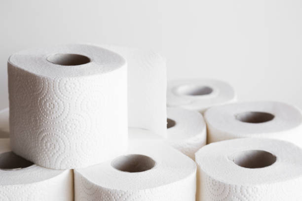 istock White toilet paper rolls on the gray background. Hygiene concept. 869108246