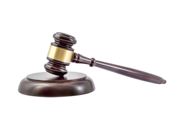 istock Wooden judge gavel with a stand isolated on white. 869108532