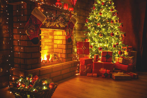 istock interior christmas. magic glowing tree, fireplace gifts in  dark 869115234